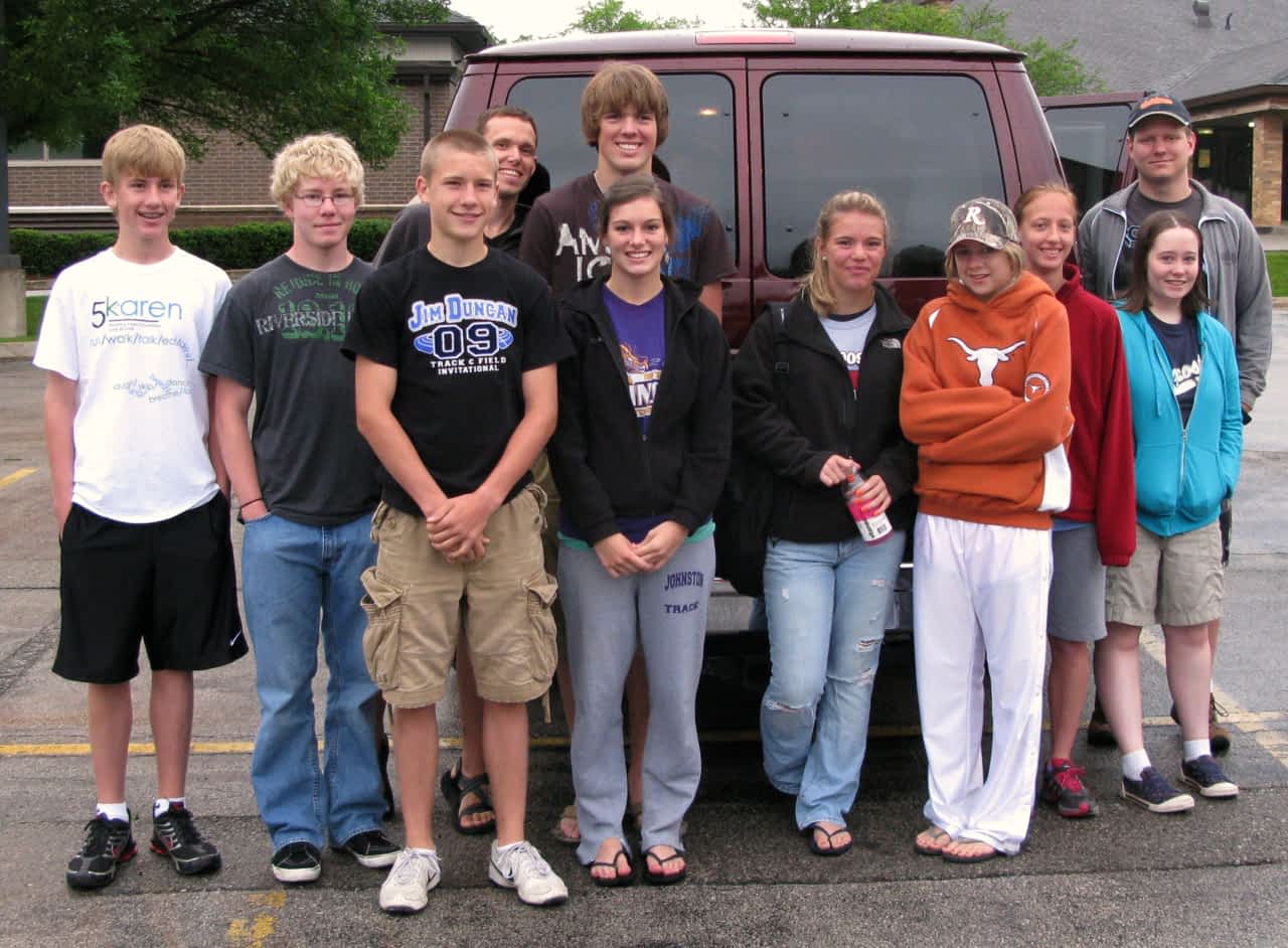 Youth in front of the van in Zion parking lot