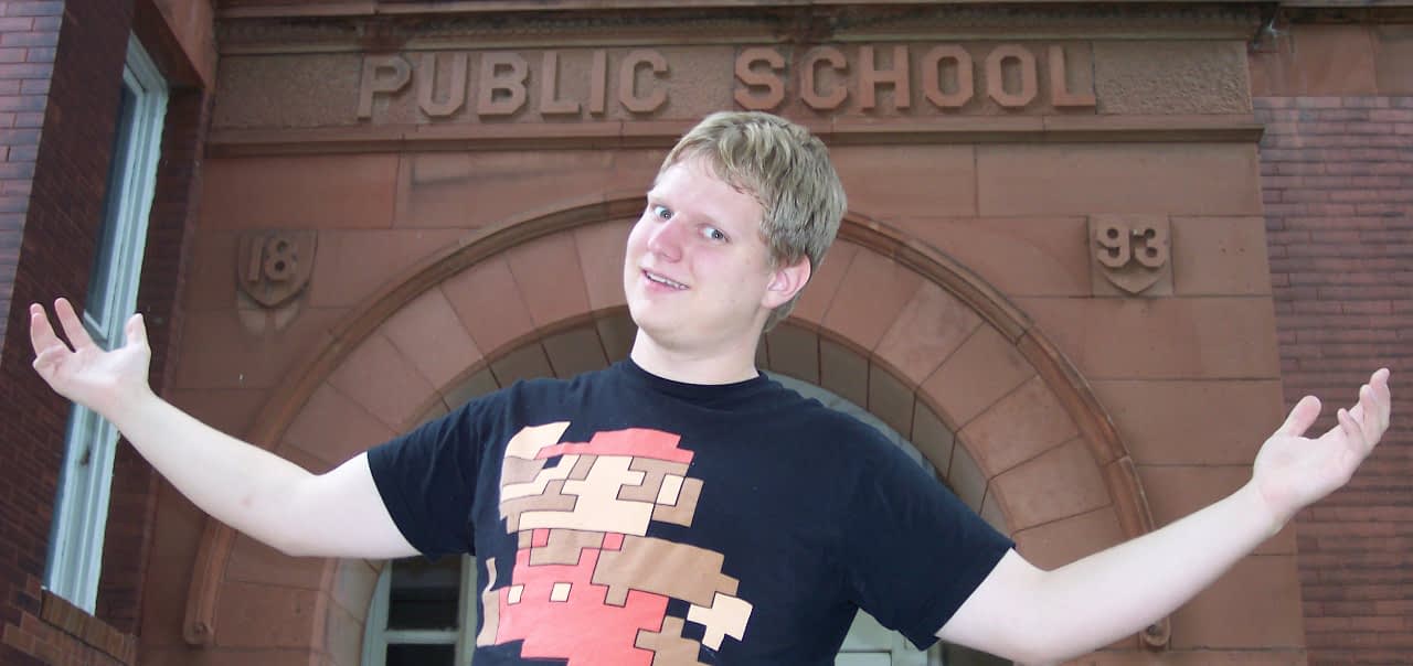 Pat in front of Lincoln School Apartments